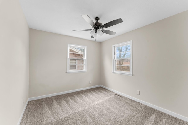 carpeted empty room with ceiling fan