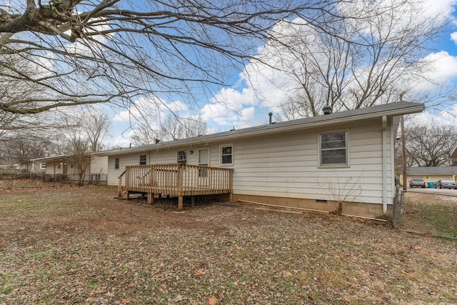 back of property with a deck