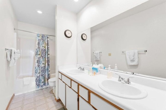 full bathroom featuring vanity, shower / tub combo, and toilet