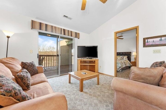 living room featuring light carpet, vaulted ceiling, and ceiling fan