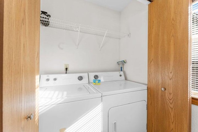 laundry area with washing machine and dryer