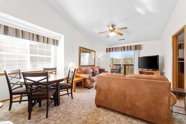 carpeted living room featuring lofted ceiling and ceiling fan