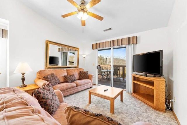 living room featuring vaulted ceiling and ceiling fan