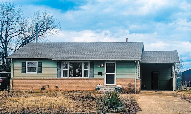 view of front of home with a carport