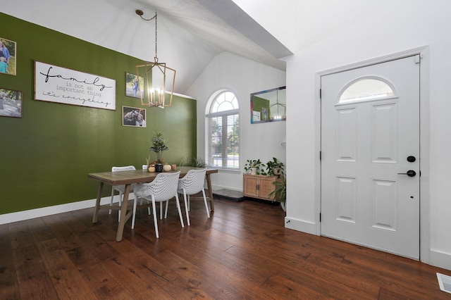 dining room featuring vaulted ceiling, dark wood-type flooring, and a chandelier