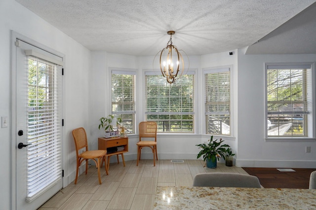 interior space featuring an inviting chandelier and plenty of natural light