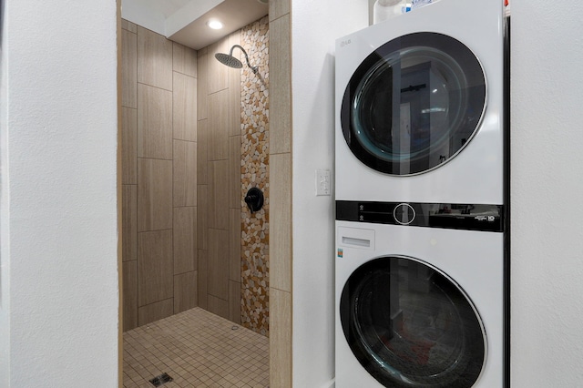 laundry area featuring stacked washing maching and dryer