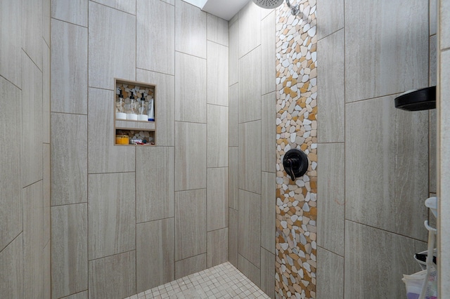 bathroom with tiled shower