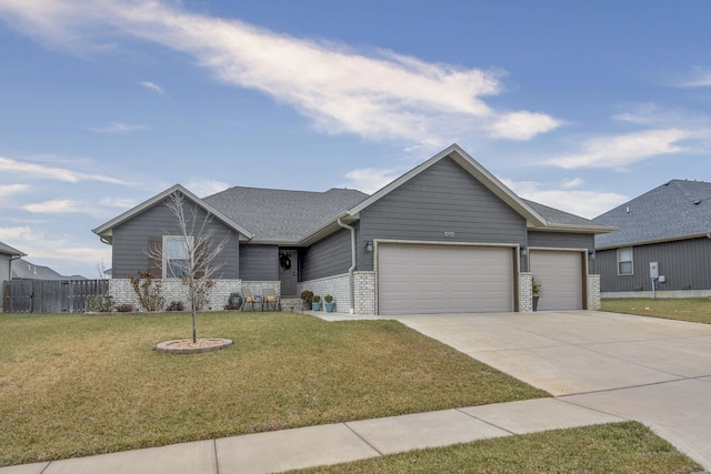 ranch-style home with a garage and a front yard