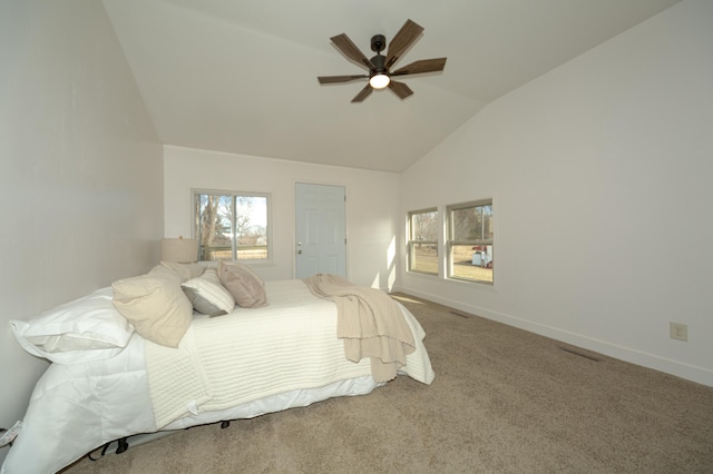 bedroom featuring vaulted ceiling, carpet flooring, and ceiling fan