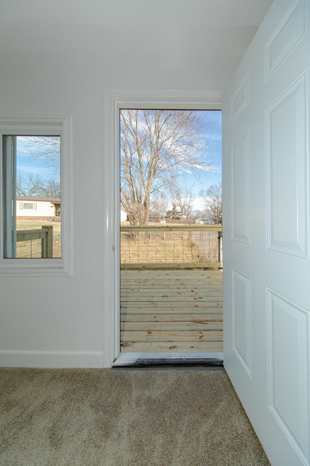 entryway with carpet flooring