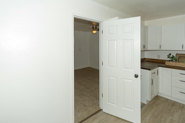 kitchen featuring white cabinetry and light hardwood / wood-style flooring