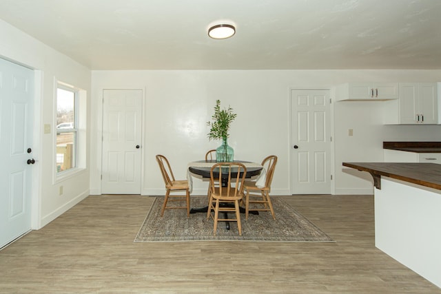 dining area with light hardwood / wood-style floors