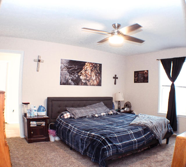 carpeted bedroom with ceiling fan