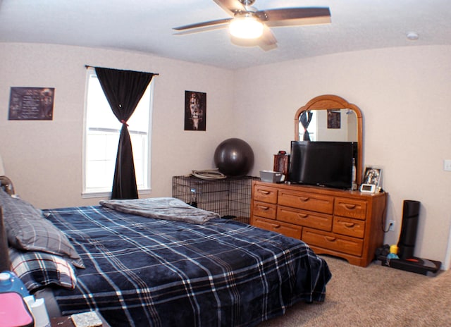 bedroom with ceiling fan and carpet flooring