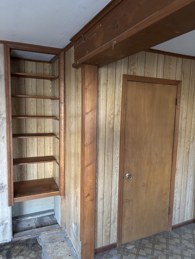 stairs with wood walls