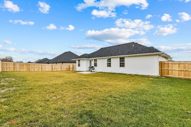 back of property featuring a yard and a patio