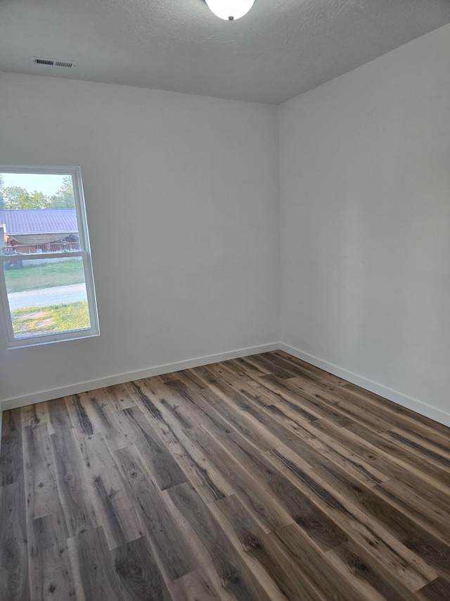 empty room featuring dark hardwood / wood-style floors