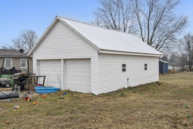 garage with a lawn