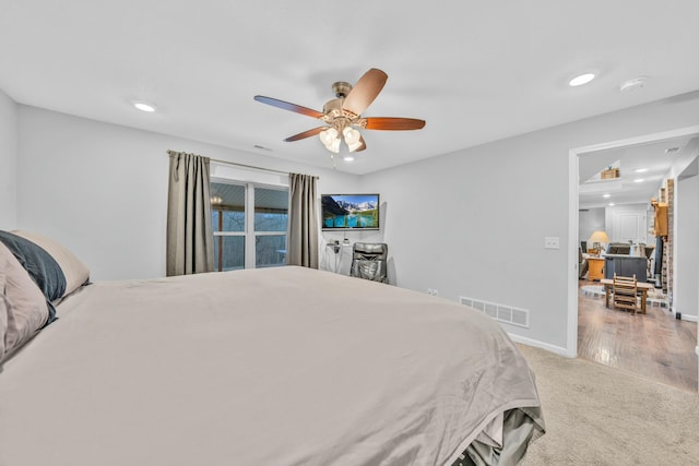 carpeted bedroom with ceiling fan