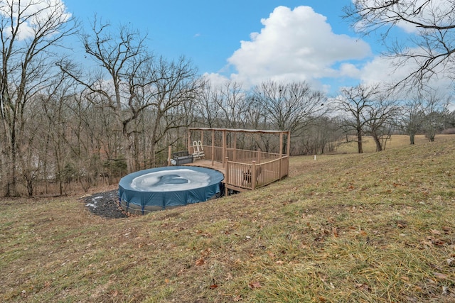 view of yard featuring a covered pool