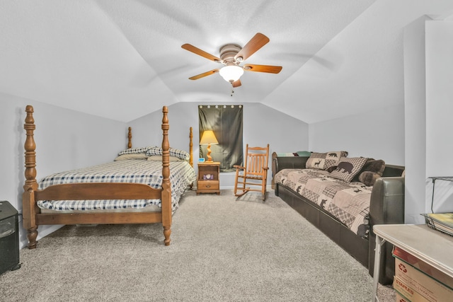 carpeted bedroom featuring ceiling fan, lofted ceiling, and a textured ceiling