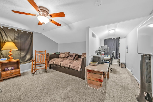 bedroom with ceiling fan, carpet flooring, and vaulted ceiling