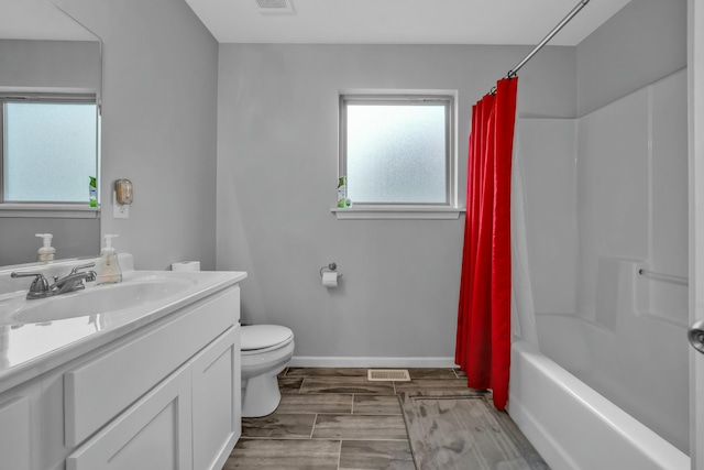 full bathroom with vanity, toilet, and shower / bath combo