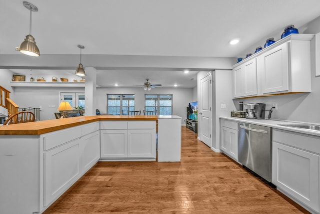 kitchen with white cabinets, decorative light fixtures, and dishwasher