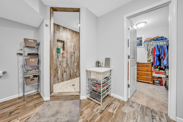 bathroom featuring a tile shower