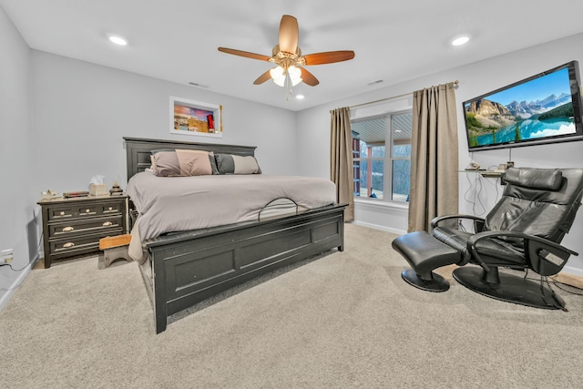 bedroom featuring light carpet and ceiling fan