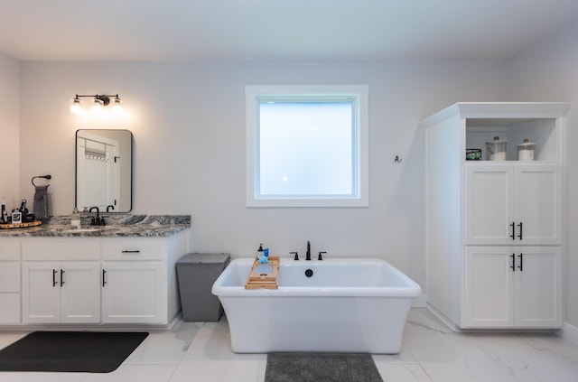 bathroom with vanity and a bathtub