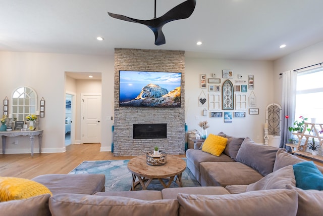 living room with a fireplace and light hardwood / wood-style floors