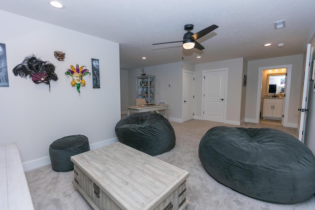 living area with light colored carpet