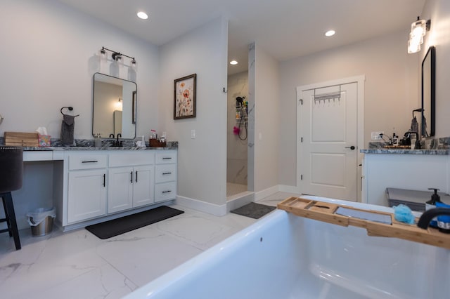 bathroom with vanity and walk in shower