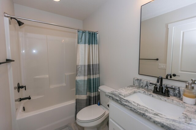 full bathroom with shower / bath combo, vanity, and toilet