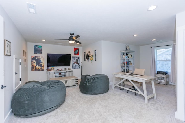 living room featuring light colored carpet and ceiling fan