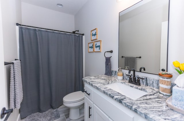 bathroom with vanity, a shower with curtain, and toilet