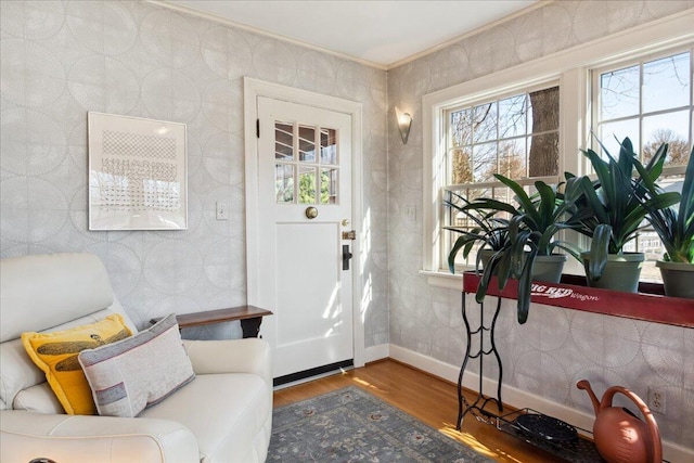 interior space featuring crown molding and hardwood / wood-style floors