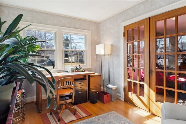 office space featuring ornamental molding and light hardwood / wood-style floors