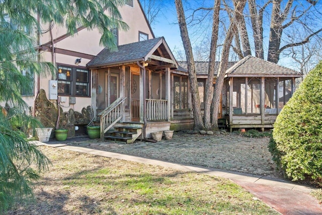 view of front facade featuring a sunroom