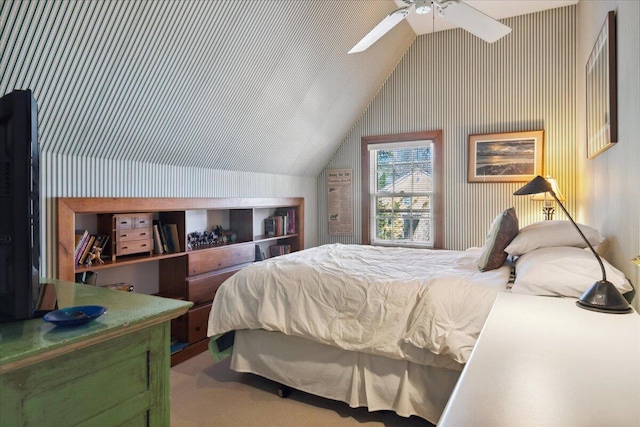 bedroom featuring ceiling fan, carpet flooring, and vaulted ceiling