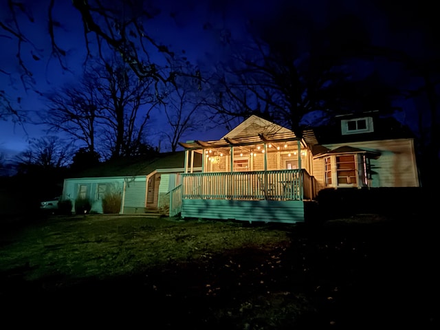 view of back house at night