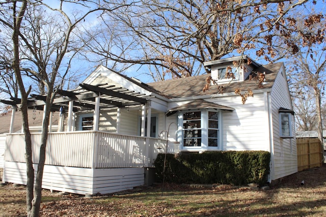 view of front of house with a pergola