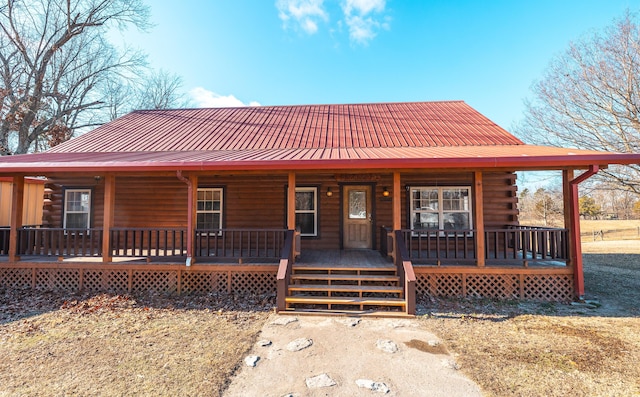 log cabin with a porch