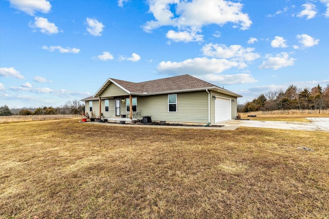 ranch-style home featuring a garage and a front yard