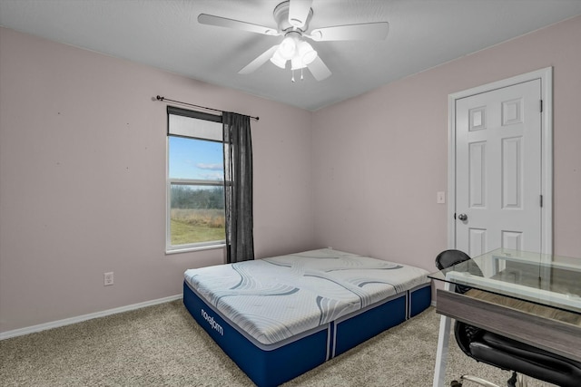 bedroom with light colored carpet and ceiling fan