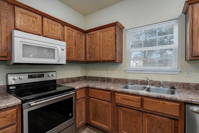 kitchen with appliances with stainless steel finishes and sink