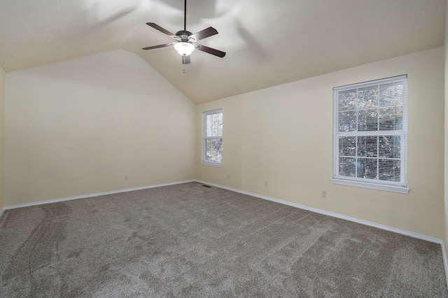 spare room featuring ceiling fan, lofted ceiling, and carpet floors