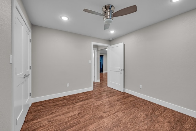 unfurnished bedroom featuring hardwood / wood-style flooring and ceiling fan